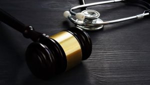 How can healthcare businesses protect themselves against medical negligence claims